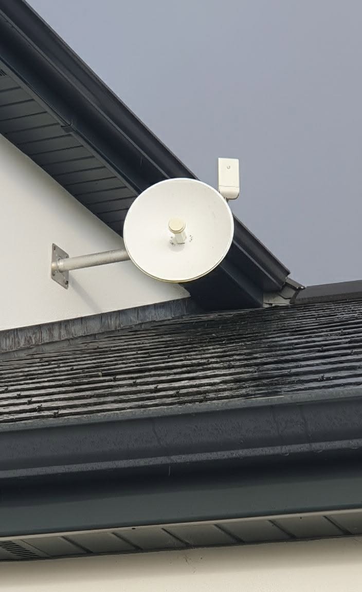Wireless bridge on a wall bracket
